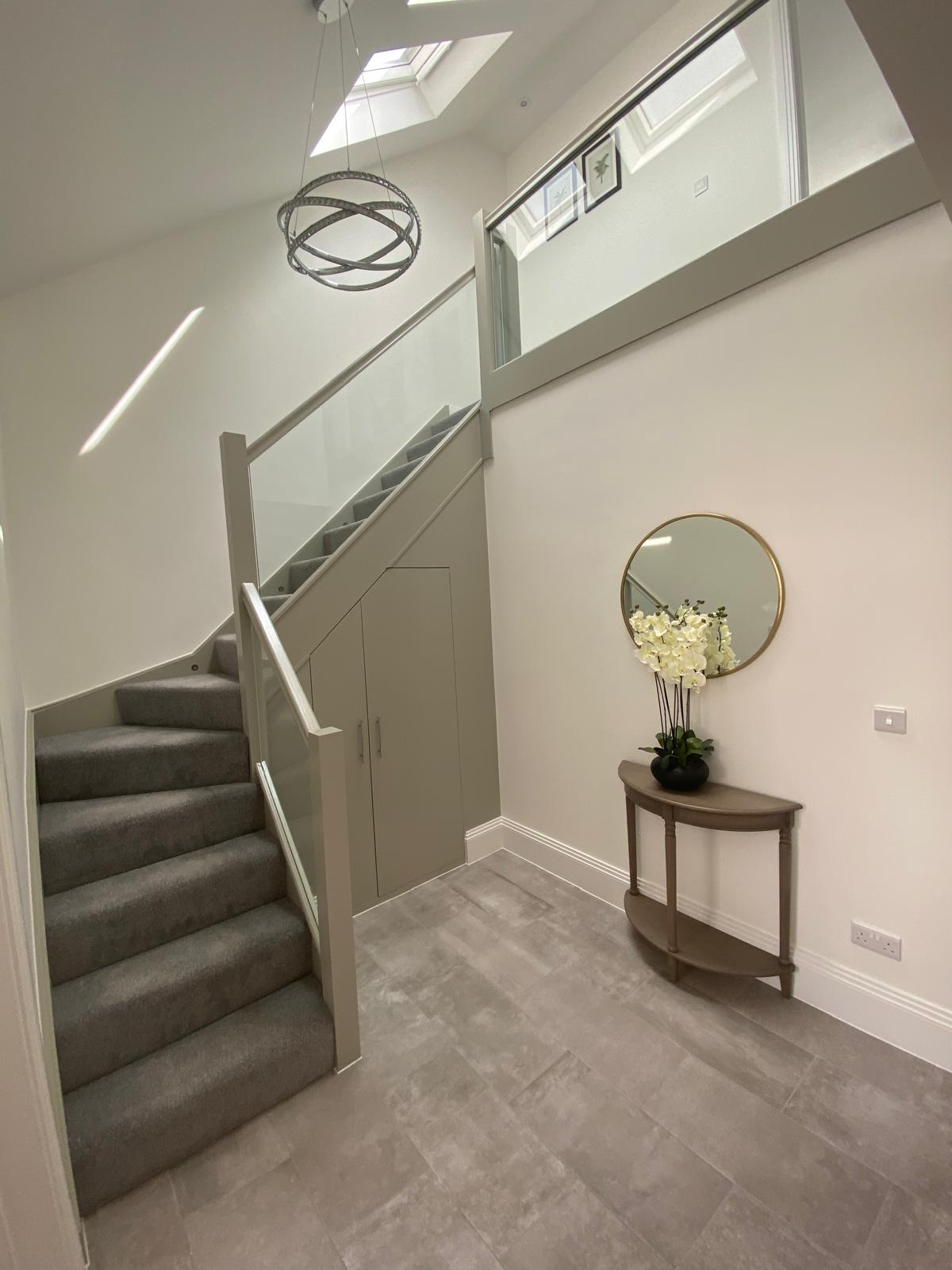 Renovated hallway with glass balustrade in Sussex