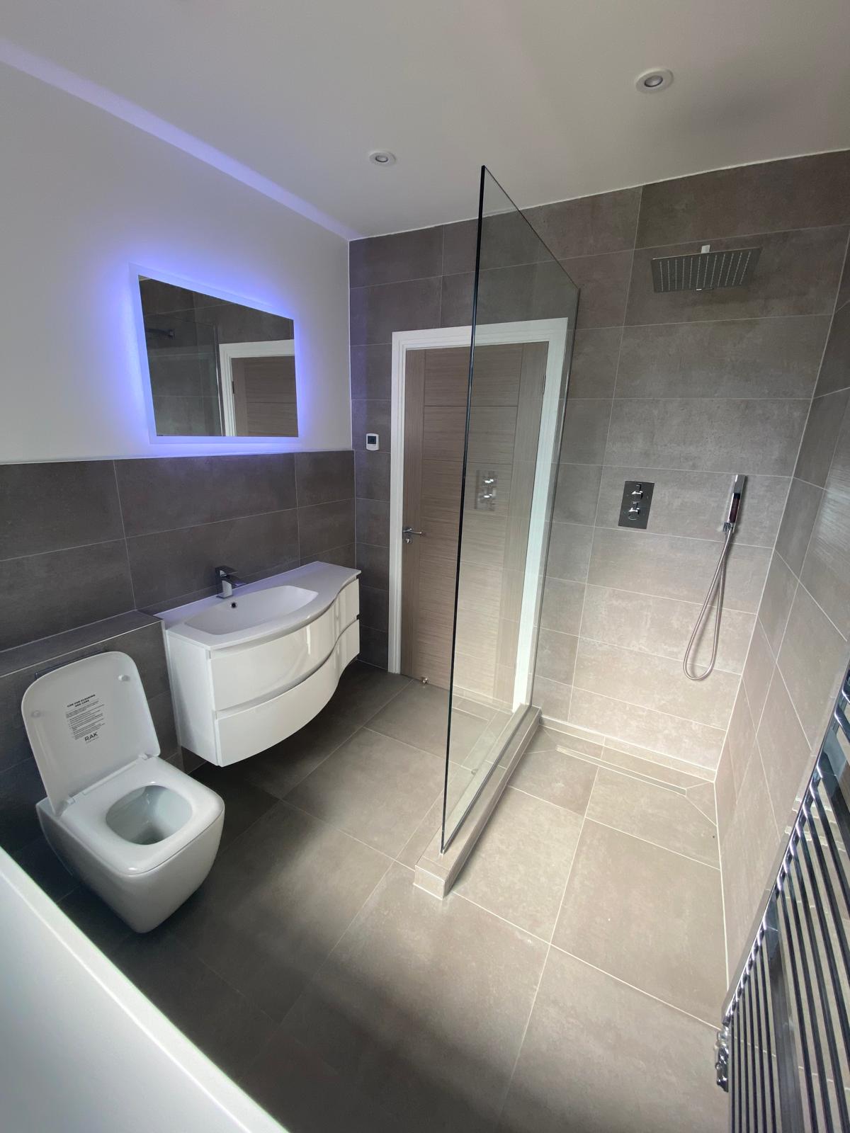 Finished bathroom with walk-in shower in Sussex
